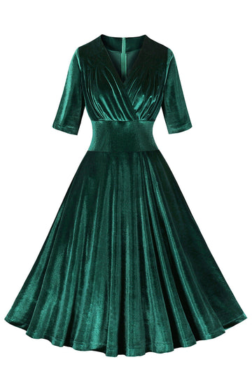 Vestido de terciopelo verde oscuro con volantes y cuello en V de la década de 1950
